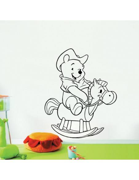Sticker Winnie l'ourson sur cheval à bascule