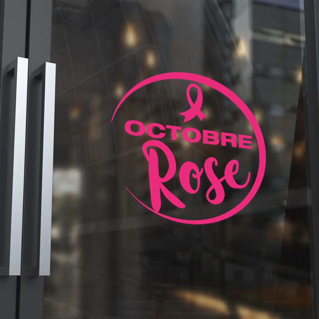 Sticker Octobre Rose rose en vinyle posé sur une vitrine